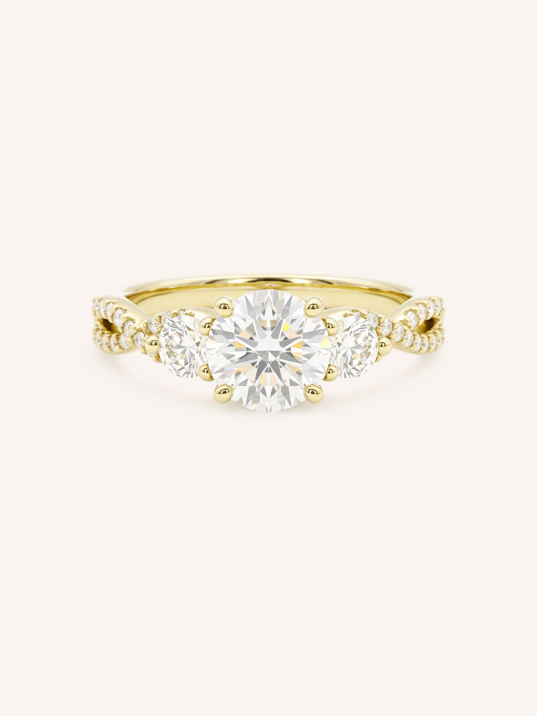 Yellow gold three-stone engagement ring with round-cut center diamond, round side diamonds, and twisted pave diamond shank, front view, on white background