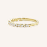 Yellow gold Mandana diamond anniversary band side view on white background