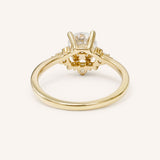 Yellow gold Merilyn round diamond cluster engagement ring back view on white background