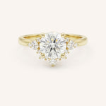 Yellow gold Merilyn round diamond cluster engagement ring front view on white background
