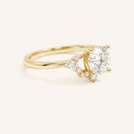 Yellow Gold Merilyn Round Diamond Cluster Engagement Ring side view on white background