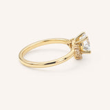 Yellow gold Merilyn round diamond cluster engagement ring side view on white background