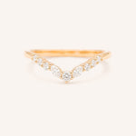 Rose gold ring with diamonds on a white background