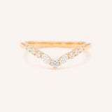 Rose gold ring with diamonds on a white background