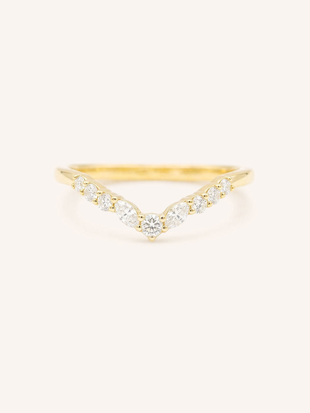 Gold ring with diamonds on a white background