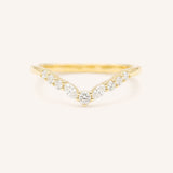 Gold ring with diamonds on a white background