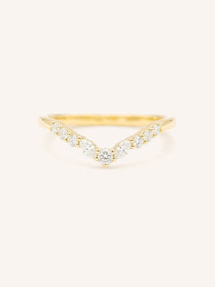 Gold ring with diamonds on a white background