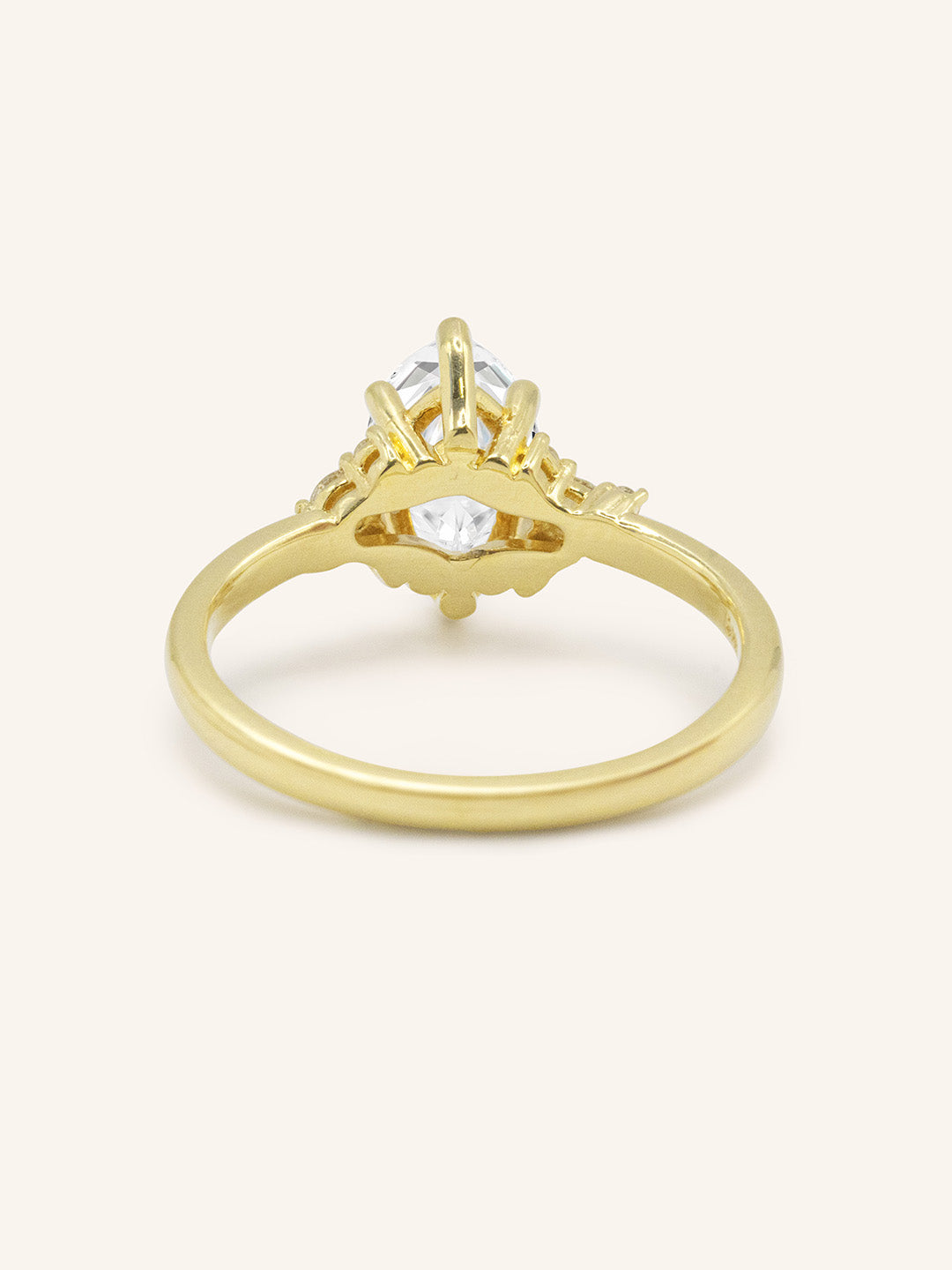 Yellow gold Starfield marquise diamond cluster engagement ring back view on white background