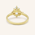 Yellow gold Starfield marquise diamond cluster engagement ring back view on white background
