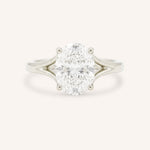 White Gold oval diamond split shank engagement ring on white background