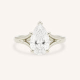 White Gold pear cut diamond split shank engagement ring on white background