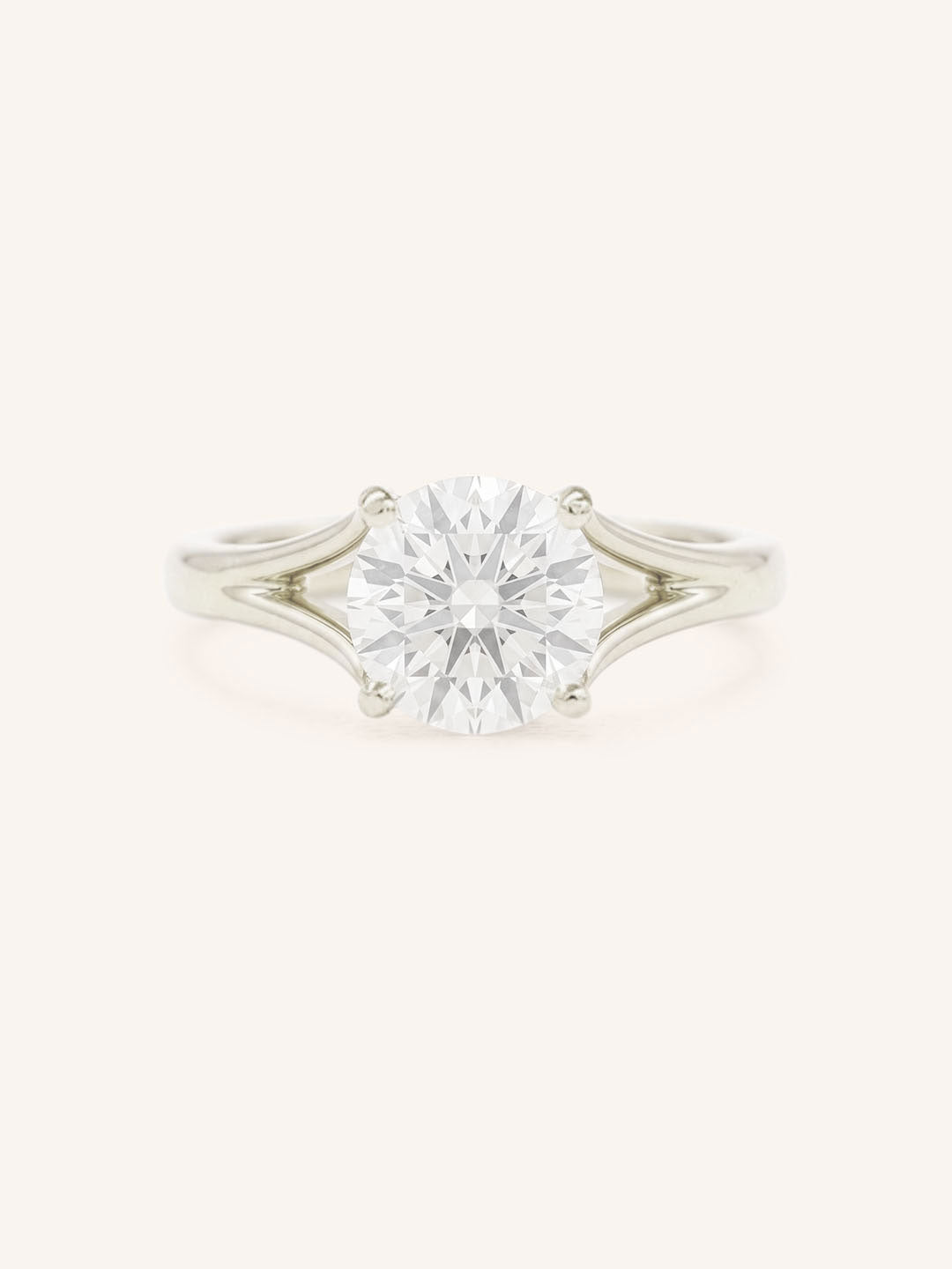 White Gold round diamond split shank engagement ring on white background