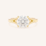 Yellow Gold round diamond split shank engagement ring on white background