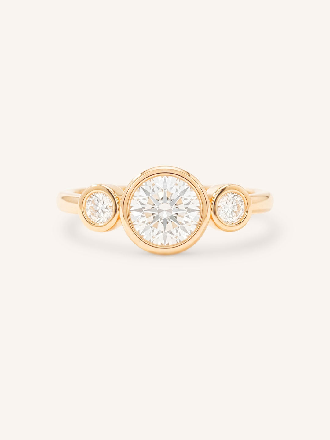 Rose Gold Tamara Round Three Stone Diamond Bezel Engagement Ring front view on white background