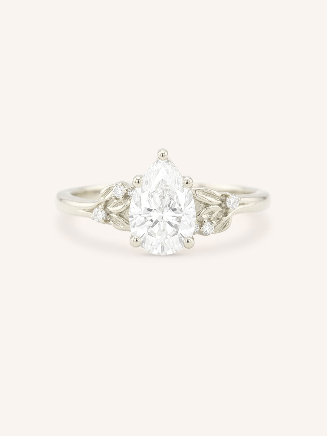 White gold floral pear diamond engagement ring front view on white background