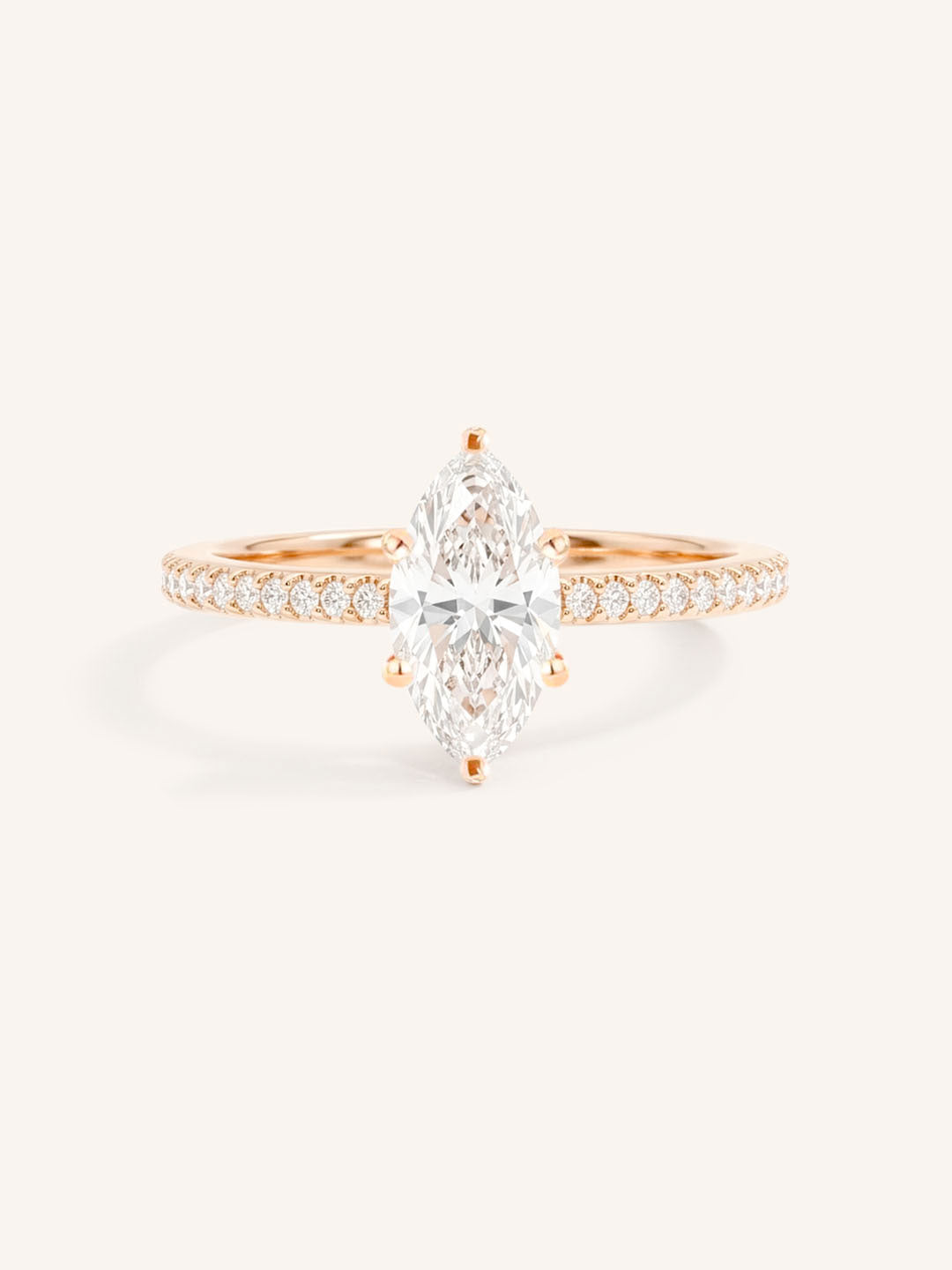 Rose gold marquise diamond solitaire engagement ring with diamond accents front view on white background