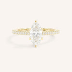 Yellow gold marquise diamond solitaire engagement ring with diamond accents front view on white background