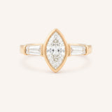 Rose gold Grannis marquise three stone and baguette diamond engagement ring front view on white background