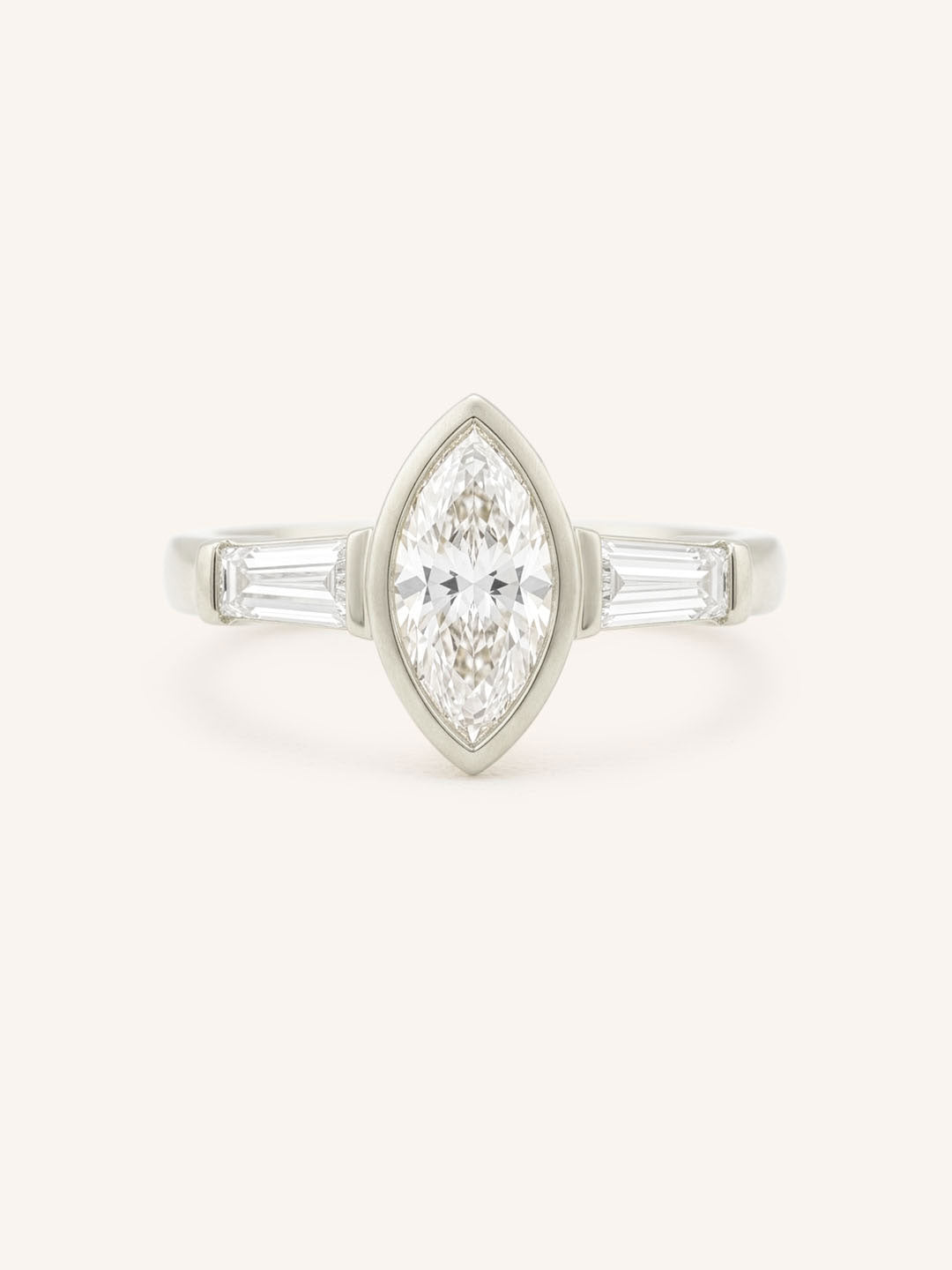 White gold Grannis marquise three stone and baguette diamond engagement ring front view on white background