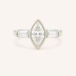 White gold Grannis marquise three stone and baguette diamond engagement ring front view on white background