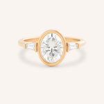 Rose gold Grannis three stone oval and baguette diamond engagement ring front view on white background