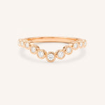 Rose gold Glissad curved diamond wedding band front view on white background