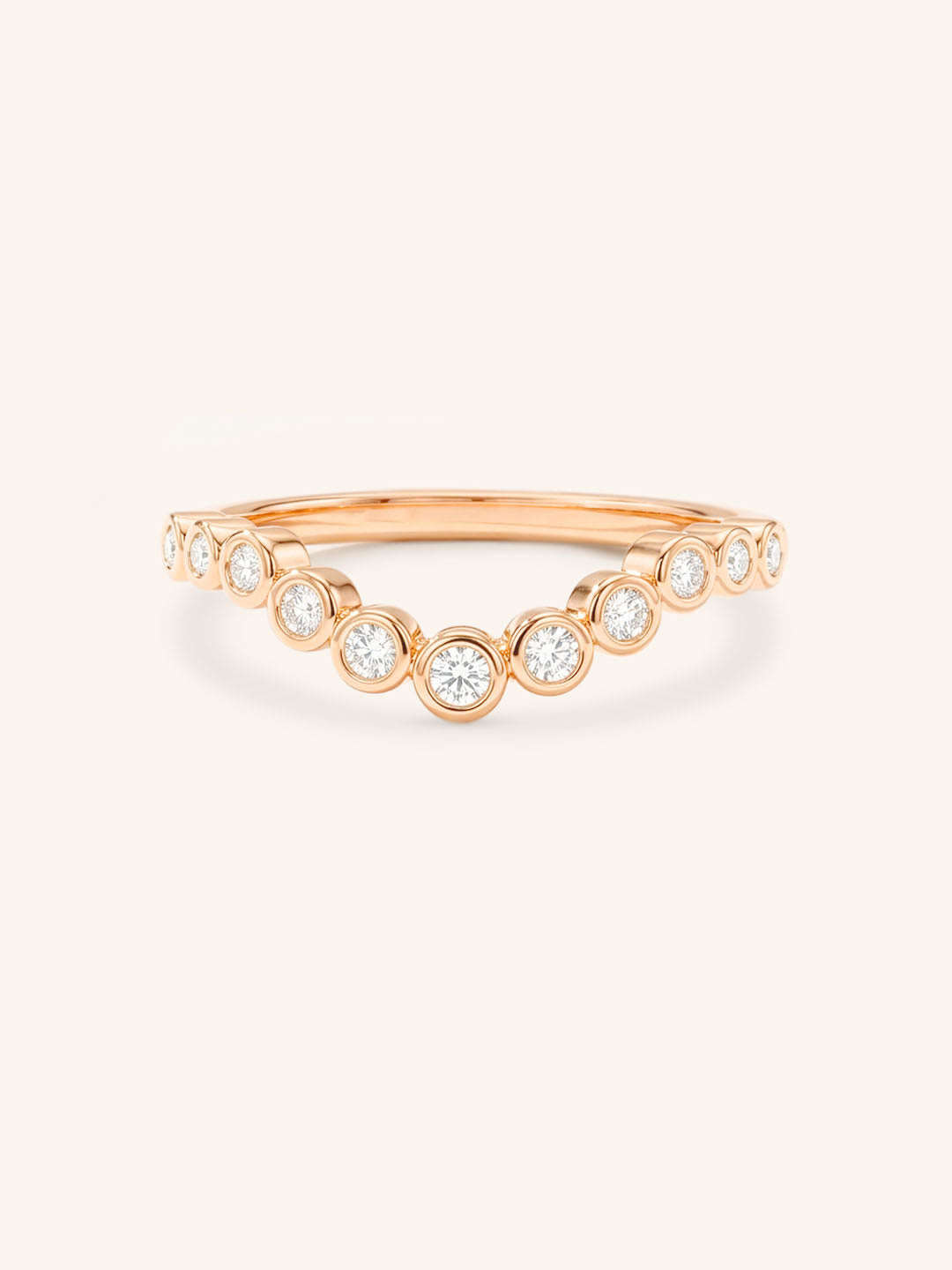 Rose gold Glissad curved diamond wedding band front view on white background