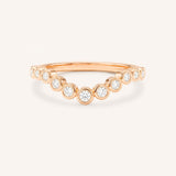 Rose gold Glissad curved diamond wedding band front view on white background