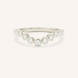 White gold Glissad curved diamond wedding band front view on white background