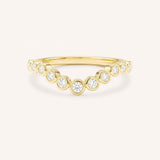 Yellow gold Glissad curved diamond wedding band front view on white background