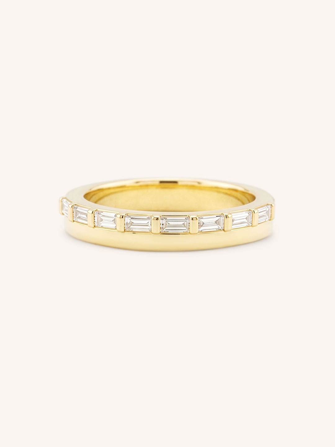 Yellow gold Eleanor off-set diamond anniversary band front view on white background