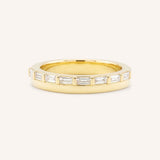 Yellow gold Eleanor off-set diamond anniversary band front view on white background
