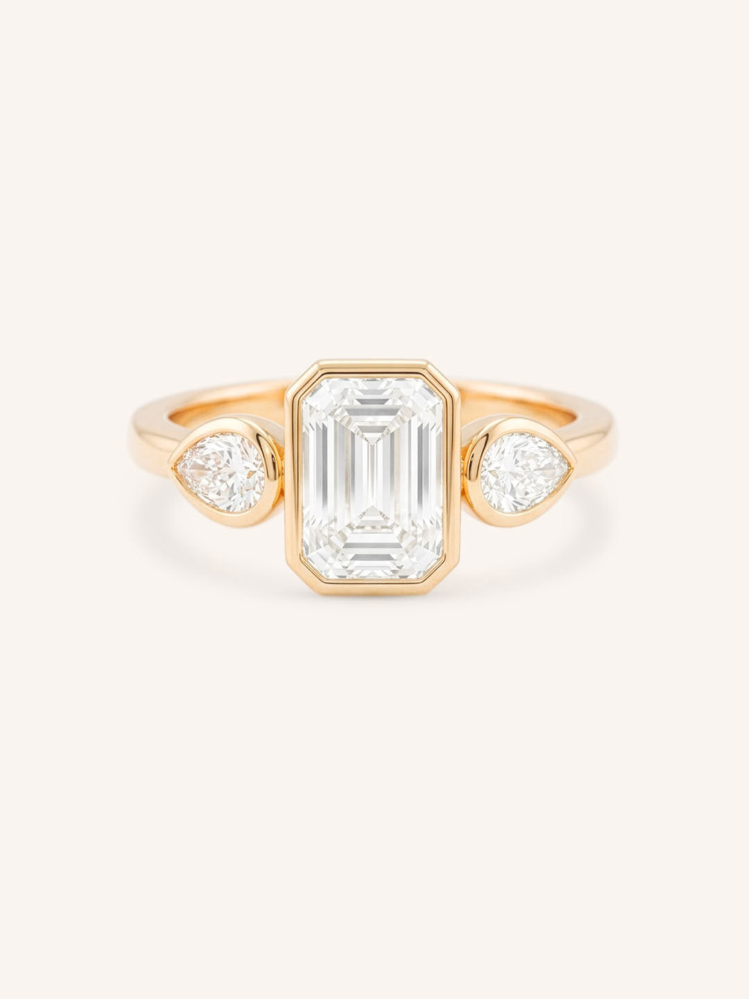 Jessie Emerald Cut and Pear Diamond Bezel Three Stone Engagement Ring
