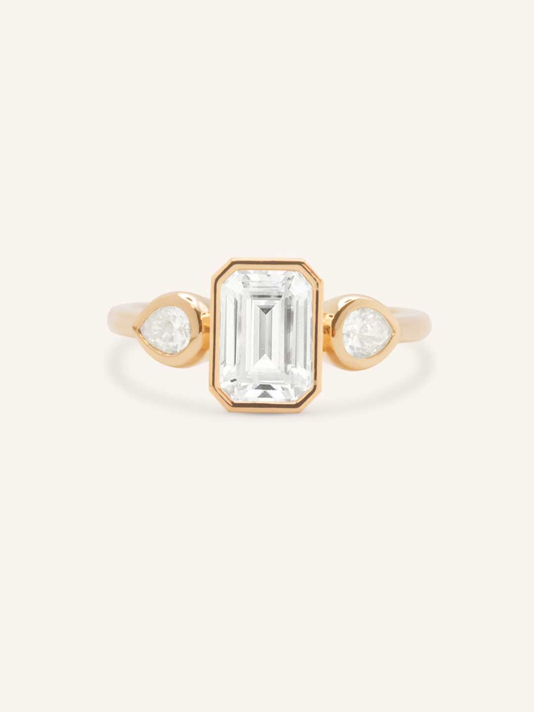 Jessie Emerald Cut and Pear Diamond Bezel Three Stone Engagement Ring