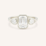 Jessie Emerald Cut and Pear Diamond Bezel Three Stone Engagement Ring