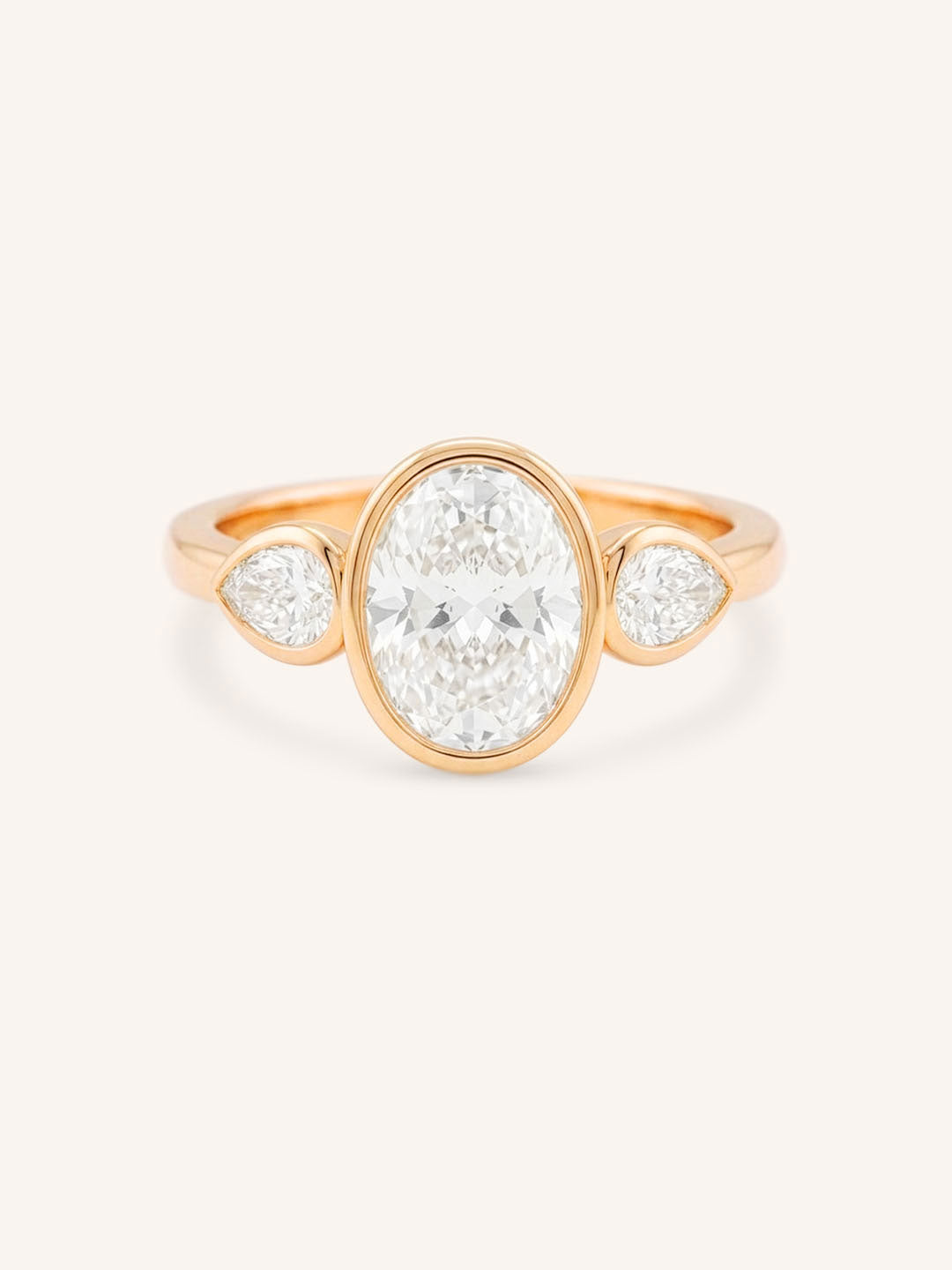 Jessie Oval and Pear Diamond Bezel Three Stone Engagement Ring