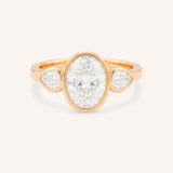 Jessie Oval and Pear Diamond Bezel Three Stone Engagement Ring