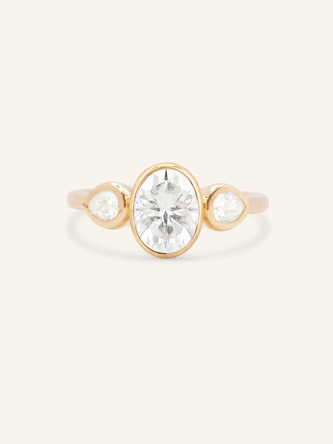 Jessie Oval and Pear Diamond Bezel Three Stone Engagement Ring