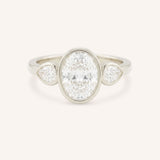 Jessie Oval and Pear Diamond Bezel Three Stone Engagement Ring