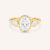 Jessie Oval and Pear Diamond Bezel Three Stone Engagement Ring