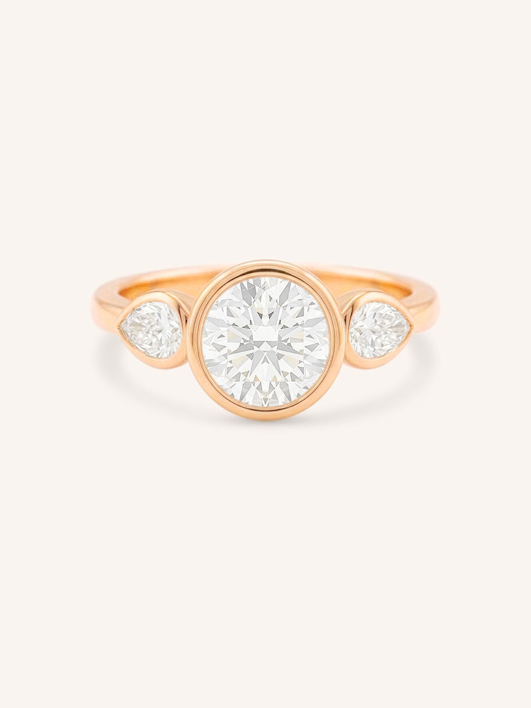 Jessie Round and Pear Diamond Bezel Three Stone Engagement Ring