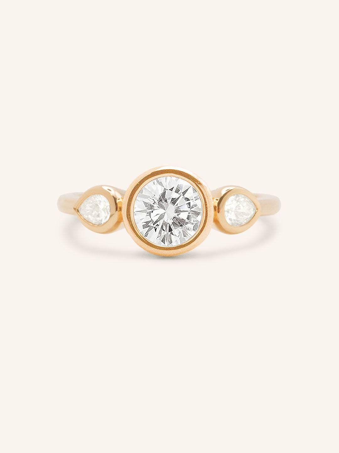 Jessie Round and Pear Diamond Bezel Three Stone Engagement Ring