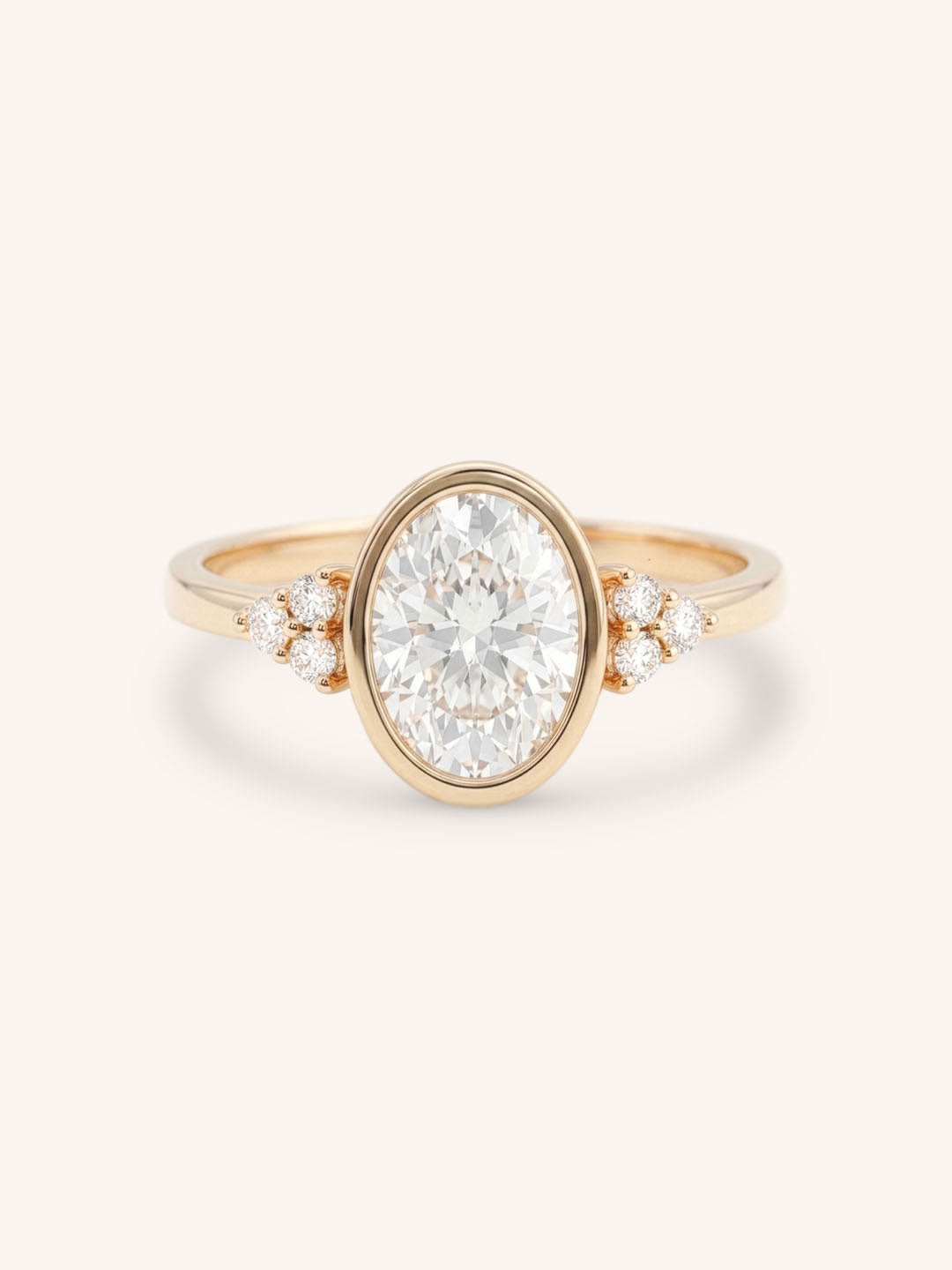 Rose gold oval cut bezel set diamond engagement ring with side stones on white background