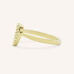 Yellow gold accented heart diamond ring side view on white background