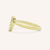 Yellow gold accented heart diamond ring side view on white background