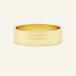 Gold ring with multiple bands on a white background