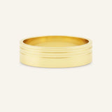 Gold ring with multiple bands on a white background