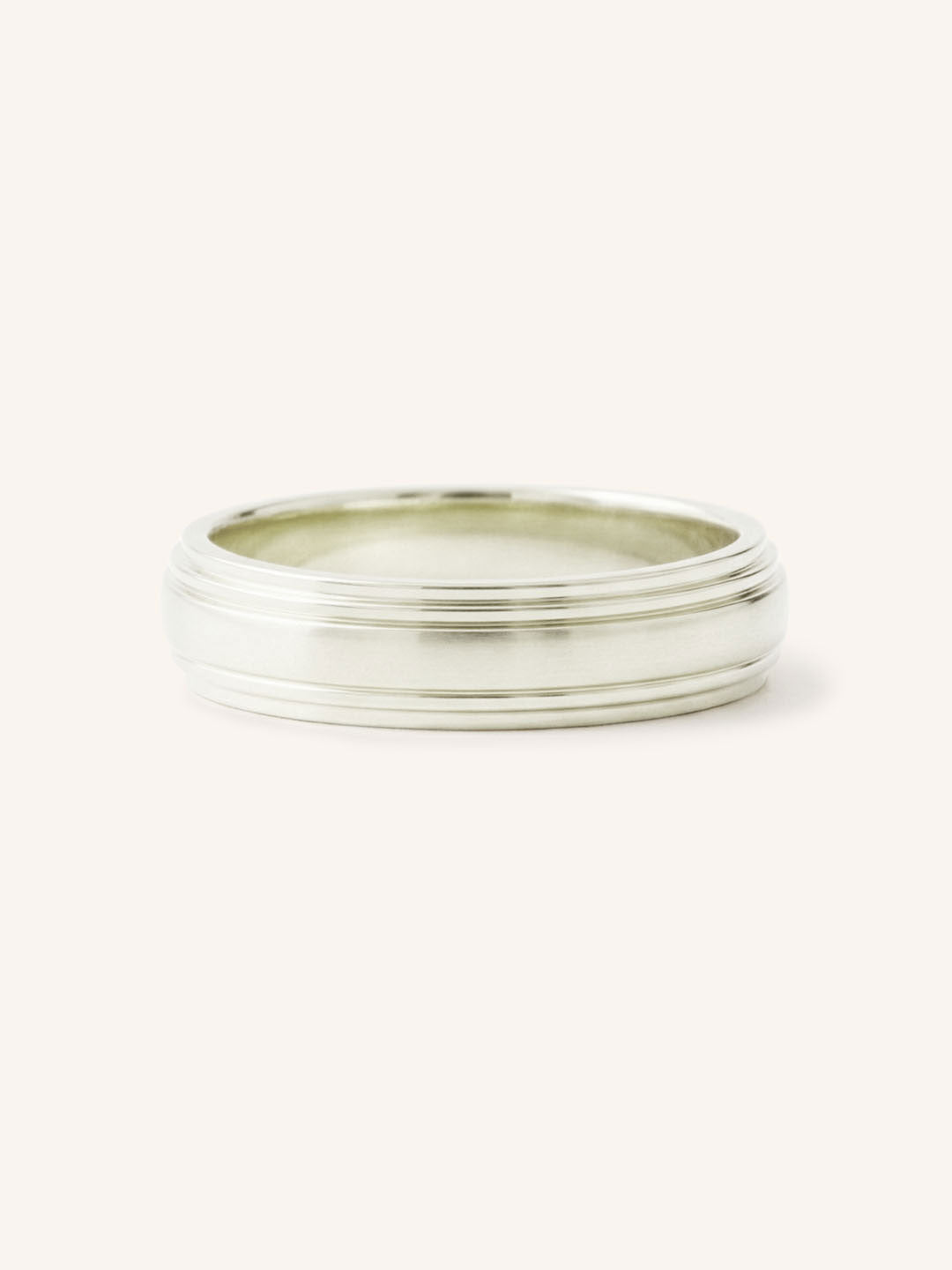 White gold double stepped edge 4mm wedding band front view on white background