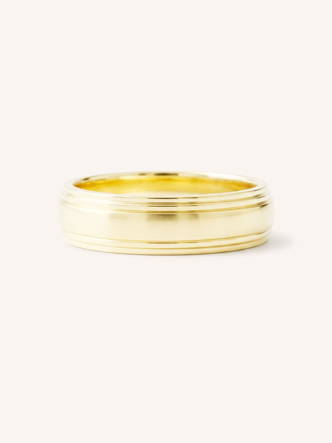 Yellow gold double stepped edge 5mm wedding band front view on white background