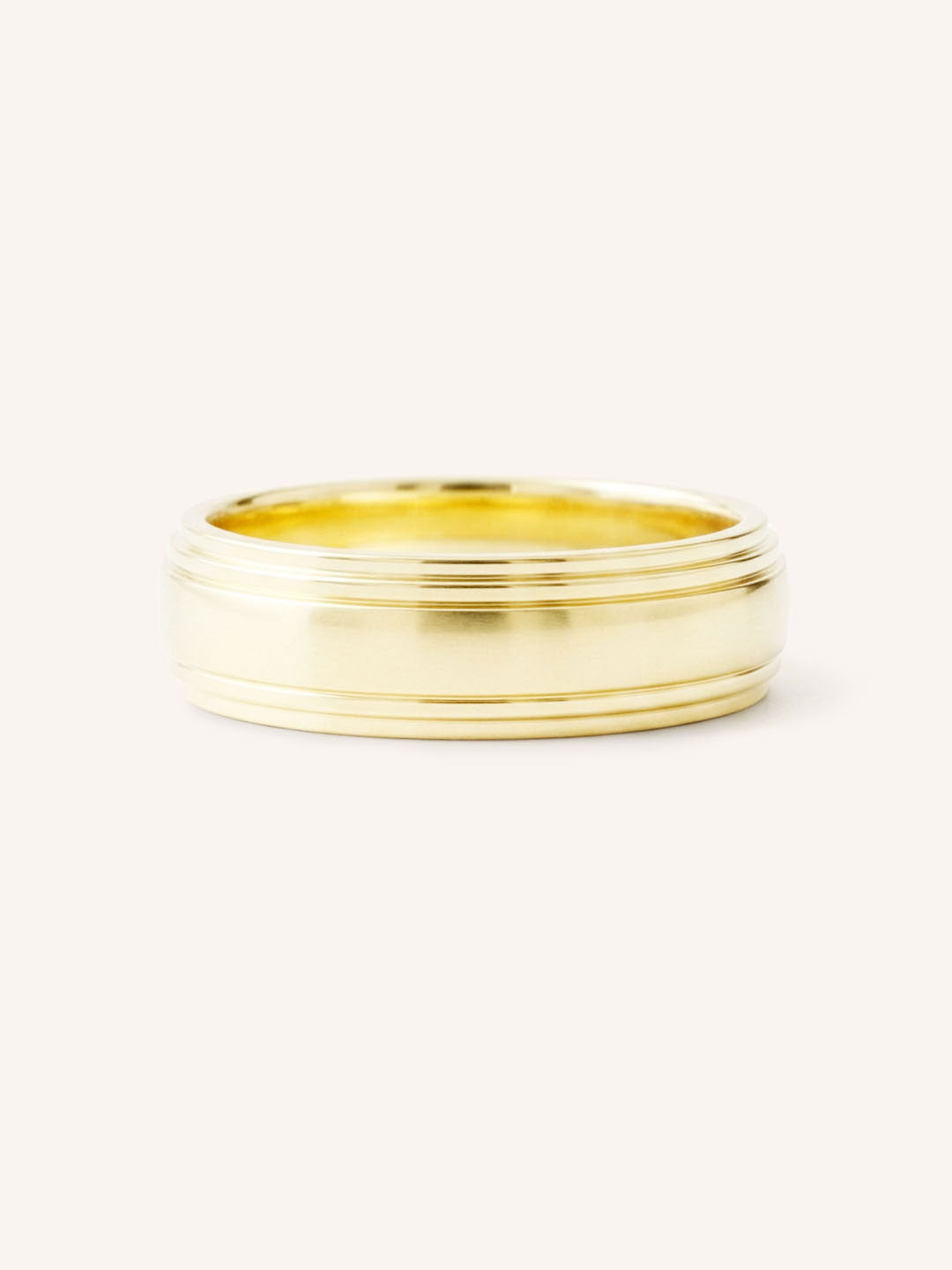 Yellow gold double stepped edge 6mm wedding band front view on white background